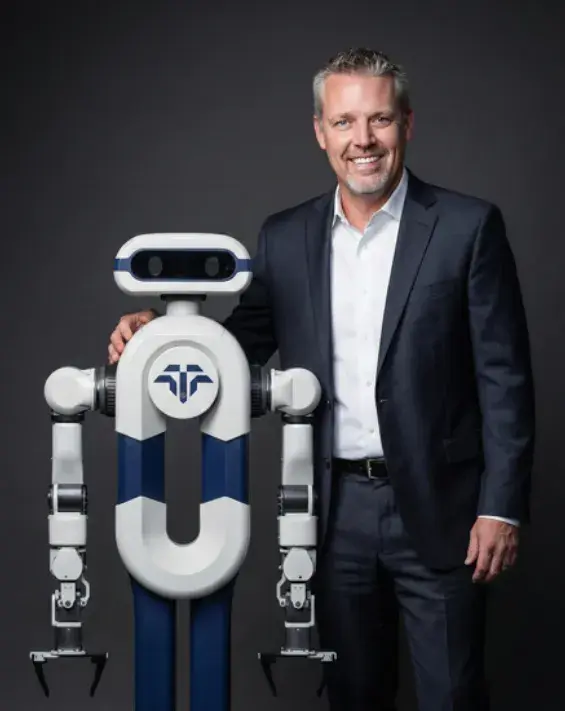 Michael Quick, Chief Commercial Officer, with the Tactus AI robot