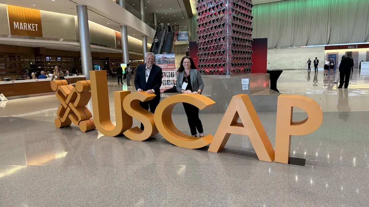 Mike Quick and Claire Weston of Tactus AI at the USCAP 2026 sign